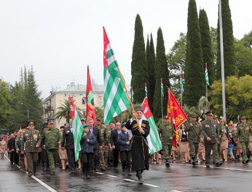 Veterans of 1991-1992 war marching at the military parade in Sukhum, September 30, 2013. Photo by Angela Kochuberia for the “Caucasian Knot”. Veterans of 1991-1992 war marching at the military parade in Sukhum, September 30, 2013. Photo by Angela Kochuberia for the “Caucasian Knot”.