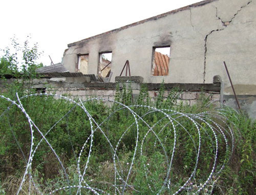 Barbed wire stretched by Russian border guards at Georgian-South Ossetian border. Georgia, July 2013. Photo by Edita Badasyan for the ‘Caucasian Knot’. Barbed wire stretched by Russian border guards at Georgian-South Ossetian border. Georgia, July 2013. Photo by Edita Badasyan for the ‘Caucasian Knot’.