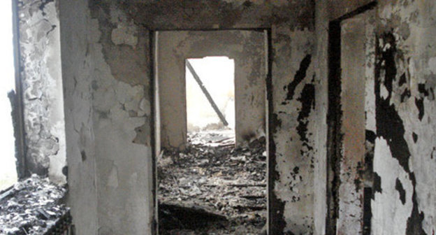 House burned down by law enforcers in the village of Yandi, Achkhoi-Martan District, December 7 2014. Photo provided by the HRC "Memorial" press-service. House burned down by law enforcers in the village of Yandi, Achkhoi-Martan District, December 7 2014. Photo provided by the HRC "Memorial" press-service.