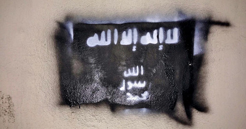 A flag of the ISIL (recognized on December 29, 2014, by the Supreme Court of the Russian Federation as a terrorist organization) on the wall of one of the buildings in Grozny. Chechnya, February 10, 2015. Photo by the "Caucasian Knot" A flag of the ISIL (recognized on December 29, 2014, by the Supreme Court of the Russian Federation as a terrorist organization) on the wall of one of the buildings in Grozny. Chechnya, February 10, 2015. Photo by the "Caucasian Knot"