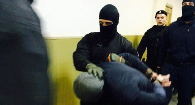 Anzor Gubashev is lead to the courtroom, March 2015. Photo by Yuliya Buslavskaya for the "Caucasian Knot" Anzor Gubashev is lead to the courtroom, March 2015. Photo by Yuliya Buslavskaya for the "Caucasian Knot"