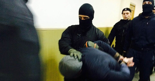 Anzor Gubashev is lead to the courtroom, March 2015. Photo by Yuliya Buslavskaya for the "Caucasian Knot"