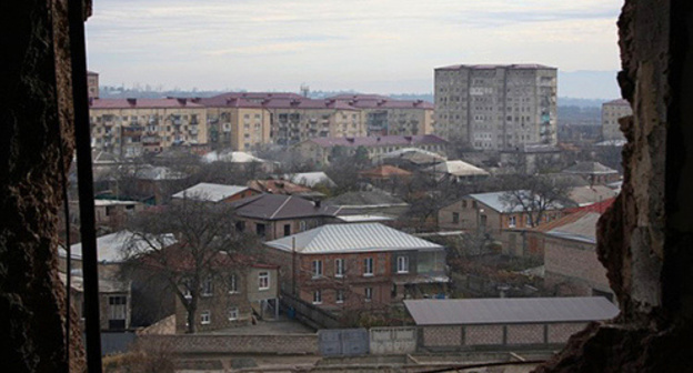 View of Tskhinvali from the window of a demolished flat on a 7th floor, December 2013. Photo by Mariya Kotaeva for the "Caucasian Knot"