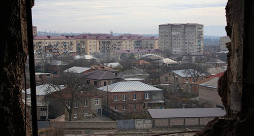 View of Tskhinvali from the window of a demolished flat on a 7th floor, December 2013. Photo by Mariya Kotaeva for the "Caucasian Knot"