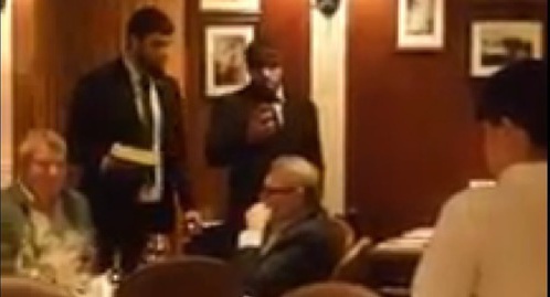 Two men who attacked Mikhail Kasyanov standing with a cake near the politician at a Moscow restaurant. Screenshot of a video of the attack on the site tv.mk.ru Two men who attacked Mikhail Kasyanov standing with a cake near the politician at a Moscow restaurant. Screenshot of a video of the attack on the site tv.mk.ru