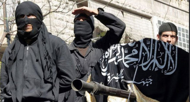 IS supporters hold Islamic State flag (Islamic State is a terrorist organization banned in Russia). Photo by user Chief Editor, www.flickr.com IS supporters hold Islamic State flag (Islamic State is a terrorist organization banned in Russia). Photo by user Chief Editor, www.flickr.com