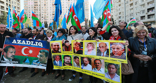 Rally participants hold portraits of human right defenders, activists and journalists, Baku, October 25, 2015. Photo by Aziz Karimov for the ‘Caucasian Knot’. Rally participants hold portraits of human right defenders, activists and journalists, Baku, October 25, 2015. Photo by Aziz Karimov for the ‘Caucasian Knot’.