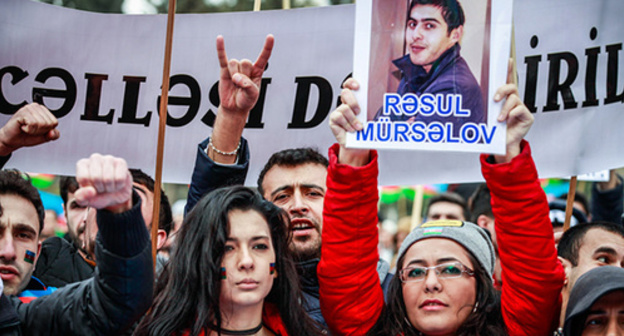 Rally participant holds portrait of political prisoner, Baku, March 125, 2015. Photo by Aziz Karimov for the ‘Caucasian Knot’. Rally participant holds portrait of political prisoner, Baku, March 125, 2015. Photo by Aziz Karimov for the ‘Caucasian Knot’.