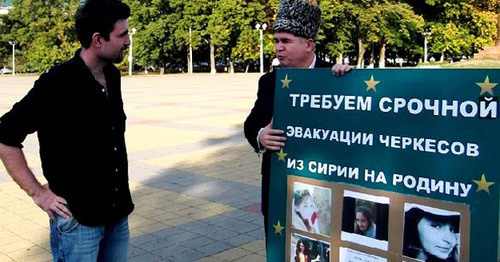 Adnan Khuade (to the right) standing in a solo picket in a square in Maikop, Adygea. Photo: Hartpress Adnan Khuade (to the right) standing in a solo picket in a square in Maikop, Adygea. Photo: Hartpress