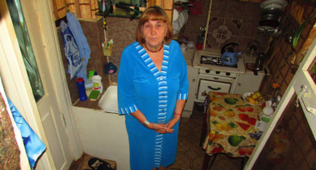 Nadezhda Shakhmardanova says that starting from July, floor in her municipal apartment in Chekhov Street began to go down, while the apartment is permanently flooded by groundwater, Astrakhan, September 2016. Photo by Vyacheslav Yaschenko for the 'Caucasian Knot'. Nadezhda Shakhmardanova says that starting from July, floor in her municipal apartment in Chekhov Street began to go down, while the apartment is permanently flooded by groundwater, Astrakhan, September 2016. Photo by Vyacheslav Yaschenko for the 'Caucasian Knot'.