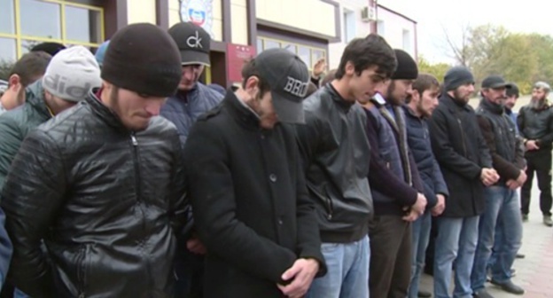 Drivers stand with their heads down while being addressed by Kadyrov. Screenshot of the video record posted on Kadyrov's page in social network vk.com/ramzan Drivers stand with their heads down while being addressed by Kadyrov. Screenshot of the video record posted on Kadyrov's page in social network vk.com/ramzan