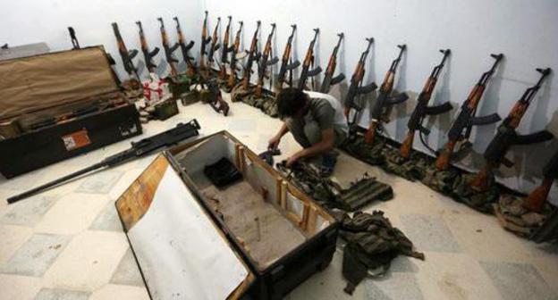 The "Al Sultan Murad Brigady" miltant in the weapons depot in the northern Syria. Photo Khalil Ashawi/ REUTERS The "Al Sultan Murad Brigady" miltant in the weapons depot in the northern Syria. Photo Khalil Ashawi/ REUTERS