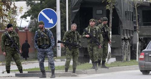 Law enforcers. Photo: REUTERS/Alkhan Gargayev Law enforcers. Photo: REUTERS/Alkhan Gargayev