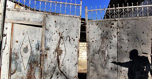 Gates of the house suffered from shelling. Photo by Famil Makhmudbeili for the Caucasian Knot. Gates of the house suffered from shelling. Photo by Famil Makhmudbeili for the Caucasian Knot.
