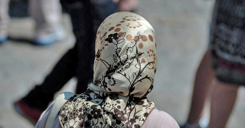 A girl wearing a headscarf. Photo by ther user Daniele Febei https://www.flickr.com A girl wearing a headscarf. Photo by ther user Daniele Febei https://www.flickr.com