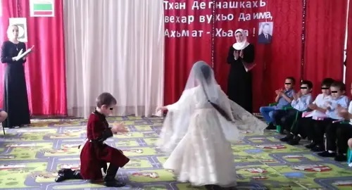 A graduation matinee in a kindergarten. Image made from video posted by Isa Dulaev Channel, https://www.youtube.com/watch?app=desktop&v=F3knShtVaHQ A graduation matinee in a kindergarten. Image made from video posted by Isa Dulaev Channel, https://www.youtube.com/watch?app=desktop&v=F3knShtVaHQ
