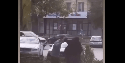 A man tried to remove niqab 
from a Muslim woman in Dagestan. Screenshot of a video posted by the Telegram channel "Chto Tam u Dagestantsev" (What's Going On With Dagestanis) on August 28, 2024 https://t.me/dagestanRD/48650