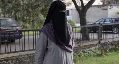 A girl wearing niqab. Screenshot of a video https://www.youtube.com/watch?v=UvfEBnWiXds A girl wearing niqab. Screenshot of a video https://www.youtube.com/watch?v=UvfEBnWiXds