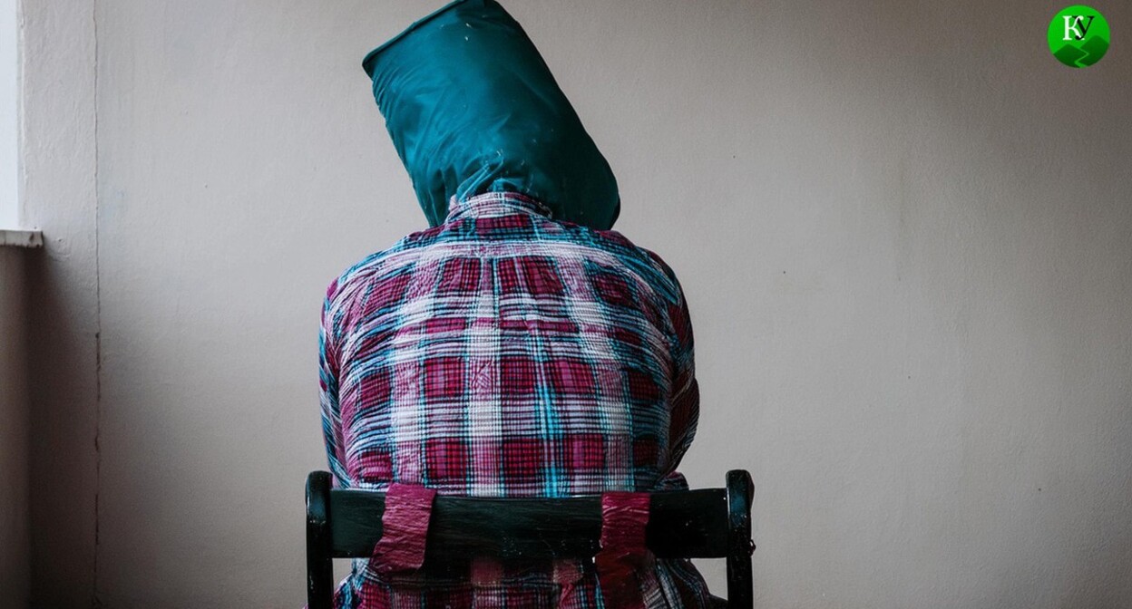 Torturing a detainee. Picture made in Photoshop by the "Caucasian Knot"