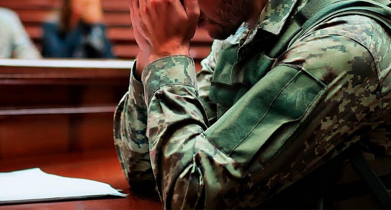 A military serviceman in a court. Picture made in Photoshop by the "Caucasian Knot"