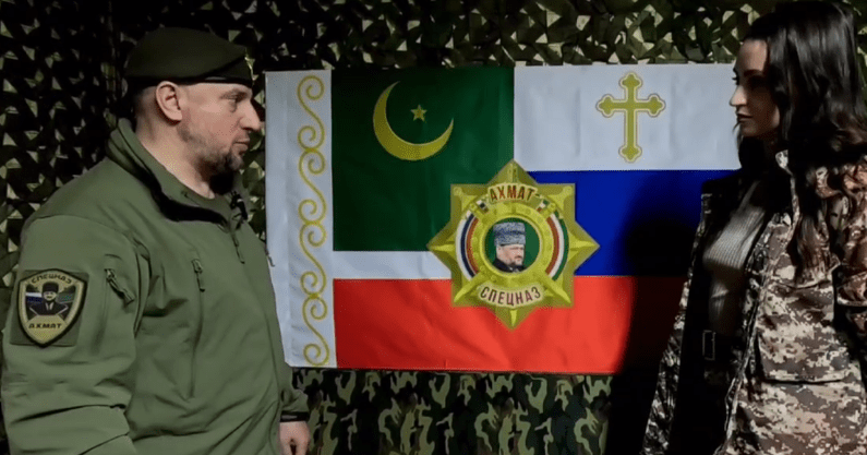 Apti Alaudinov tells a journalist about the “Akhmat” special forces battalion’s flag. A screenshot from the video posted by Anastasia Babir in her Telegram channel on May 23, 2025, https://t.me/SovaBabir/217. Apti Alaudinov tells a journalist about the “Akhmat” special forces battalion’s flag. A screenshot from the video posted by Anastasia Babir in her Telegram channel on May 23, 2025, https://t.me/SovaBabir/217.