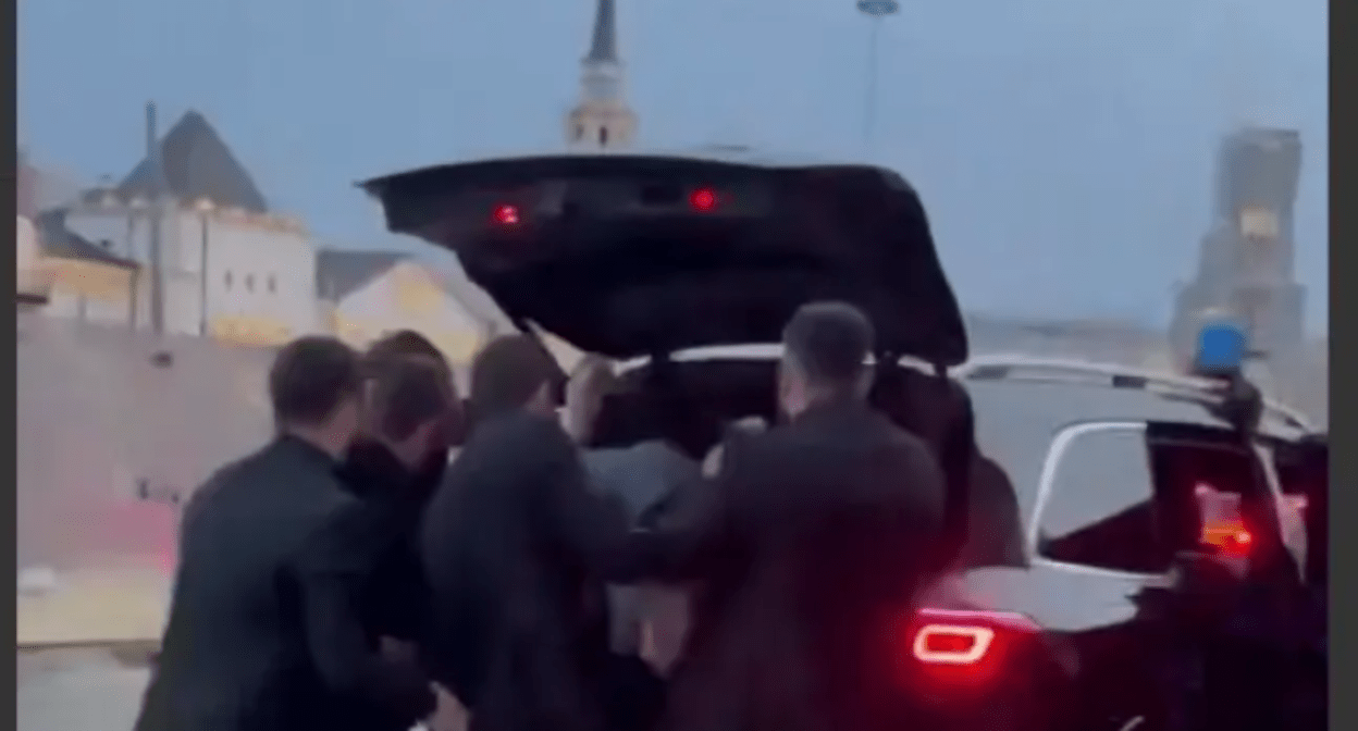 Chechen enforcers put Areg Shchepikhin in the trunk. Still image of Caucasian Knot video, https://www.youtube.com/shorts/lqkgd7MfIM8