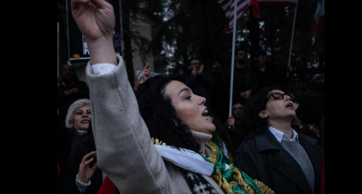 Protesters at the Iranian Embassy. Screenshot from Publika's photo from March 1, 2026, https://www.facebook.com/photo?fbid=1694962798569930&set=pcb.1694962868569923