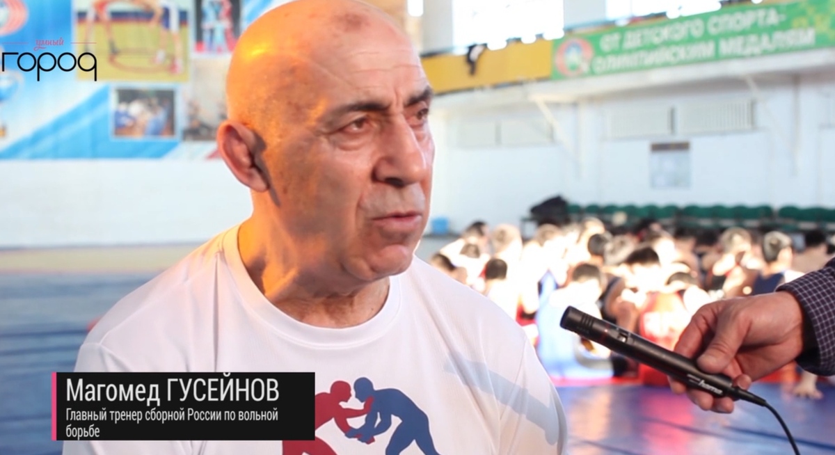 Magomed Guseinov in front of child athletes. 2015. Still from rutube_account_media_sakha https://rutube.ru/video/31726d8b0be014af3f44928d4ad20516/ Magomed Guseinov in front of child athletes. 2015. Still from rutube_account_media_sakha https://rutube.ru/video/31726d8b0be014af3f44928d4ad20516/