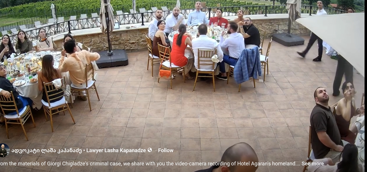 Wedding participants look up after the shouts from the balcony. Screenshot from Lasha Kapanadze's publication.