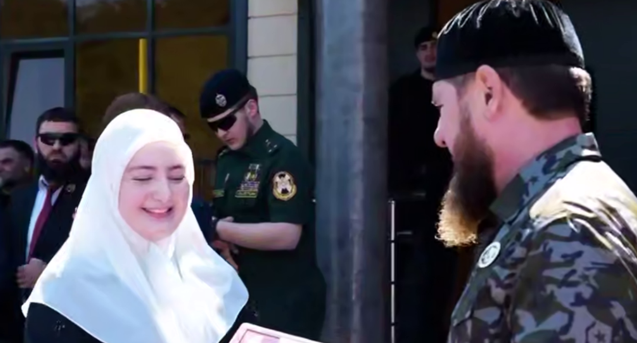 Ramzan Kadyrov awards his daughter with a medal. Frame from the video dated 21.08.26, https://t.me/MDaudov_95/3175