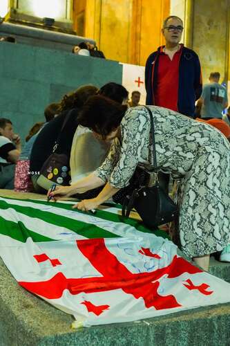 Supporters of Eurointegration in Tbilisi on the 645th day of continuous protests leave memorial inscriptions on the flag of Abkhazia. September 3, 2026. Photo MO SE/ Facebook - owned by Meta, whose activities are banned in Russia